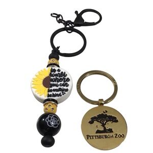 2 Keychains Pittsburgh Zoo Paw Print Sunflower in a world where you can be
